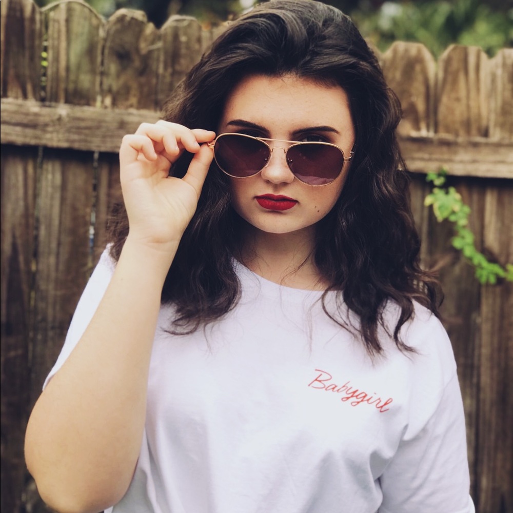 White cropped tee with the word “ babygirl “